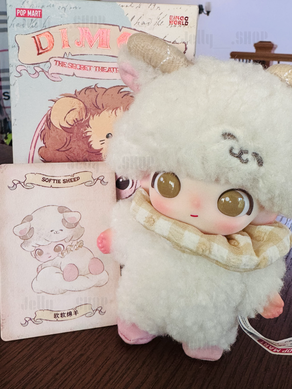 Cute POP MART DIMOO Softie Sheep plush pendant character illustration in soft colors, wearing a cozy scarf.