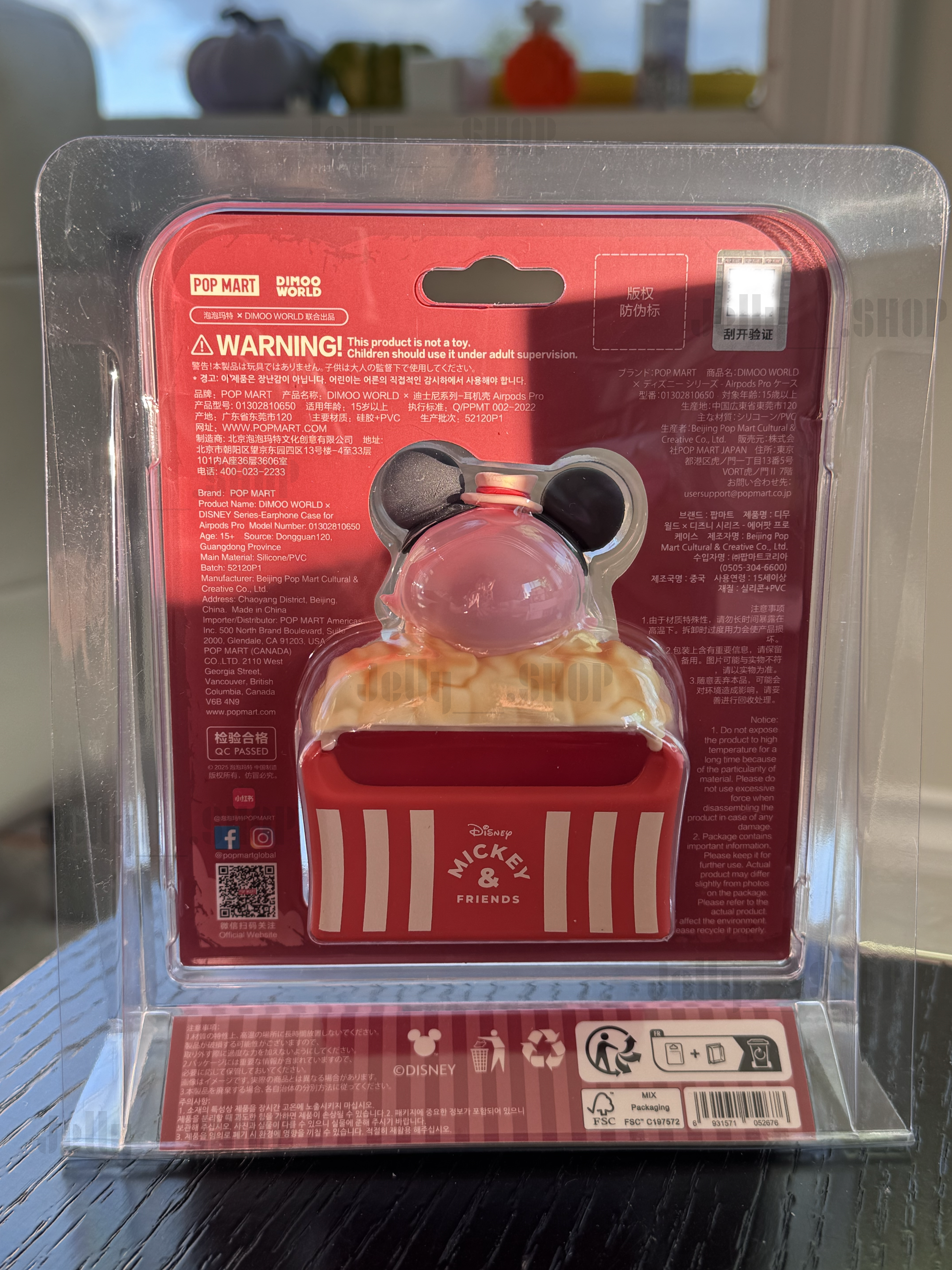 DIMOO DISNEY AirPods Pro earphone case packaging featuring Mickey Mouse design and popcorn motif.